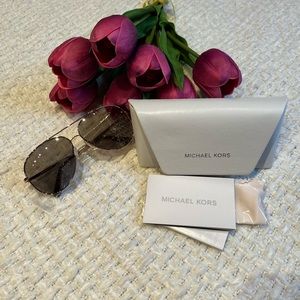 Authentic Michael kors sunglasses with signature MK on glasses